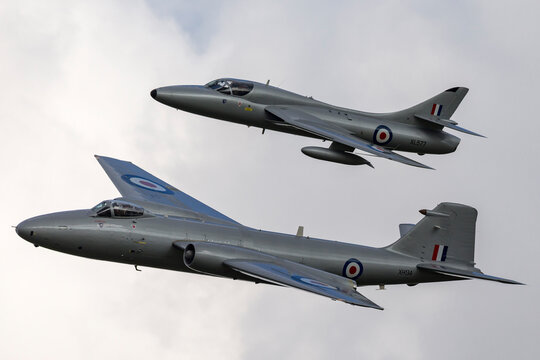 RAF Waddington, Lincolnshire, UK - July 7, 2014: Former Royal Air Force English Electric Canberra PR.9 photographic reconnaissance aircraft flying in formation with a Hawker Hunter.