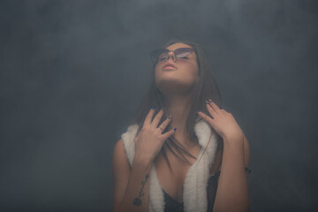 Portrait of shameless girl posing and being playful with her clothes while touching herself