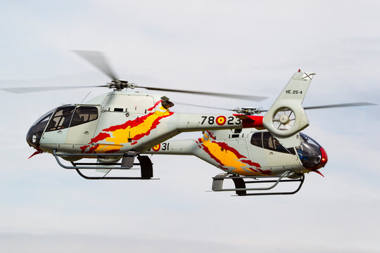 RAF Waddington, Lincolnshire, UK - July 6, 2014: Spanish Air Force Eurocopter EC-120B Colibri helicopter from the Patrulla Aspa display team performing an aerial display.