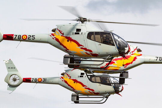 RAF Waddington, Lincolnshire, UK - July 6, 2014: Spanish Air Force Eurocopter EC-120B Colibri helicopter from the Patrulla Aspa display team performing an aerial display.