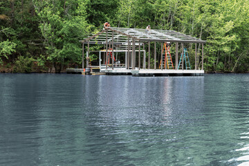 A new boat dock under construction with steel frame on a lake