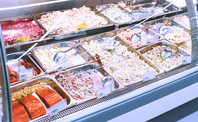 assortment of mayonnaise salads in the refrigerated display
