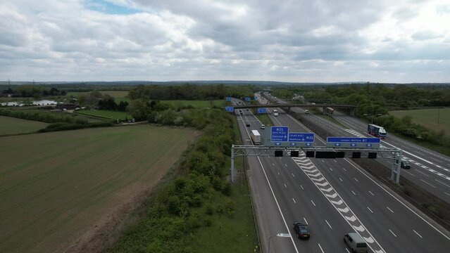 Overhead motorway signage on M1 UK drone aerial view reveal