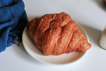 Freshly baked croissants on grey background. French and American Croissants and Baked Pastries are for breakfast.