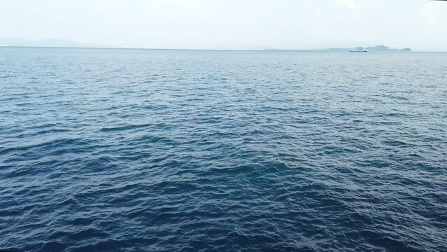 calm ocean water revealing sunda strait, lampung, indonesia travel holiday destination 