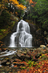 Fototapeta na wymiar Vermont waterfall in peak autumn