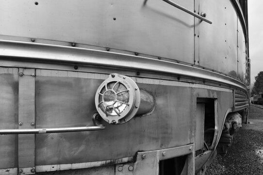 black and white toned image of the headlamp of a vintage train