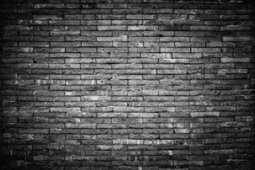Old vintage retro style dark bricks wall for abstract brick and stone work background and texture.