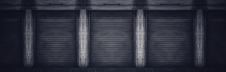 Old weathered and rusty closed steel doors for steel metal store door backgroud and texture.