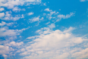 cumulus clouds against a bright blue sky. great sunny day. good summer weather.