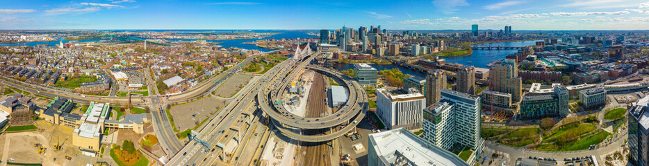 Boston downtown financial district skyline and Leonard Zakim Bridge aerial view, with Boston Harbor...