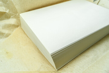 A stack of clean old-style stationery paper. Format A4 paper for documents. Selective focus