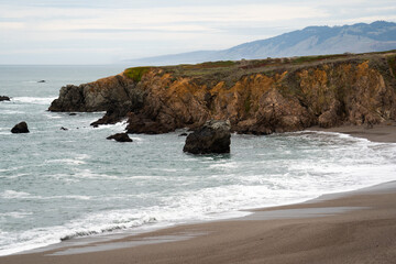Rocky northern California coastline cliff and beach near Bodega Bay.