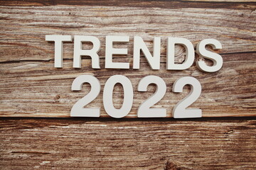 Trends 2022 alphabet letters on wooden background