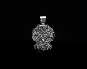 orthodox 925 sterling silver cross with the image of Christ on a black background