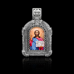 orthodox icon made of gold with the image of Christ on a black background