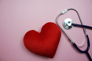 Heart and Stethoscope with space copy on pink background