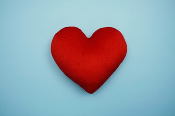 Top view Red Heart on blue background