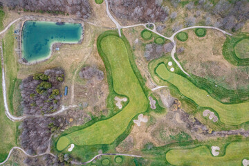 Barrie golf course hills and golf paths on a cloudy day a lot of green and cut grass  DRONE VIEW 