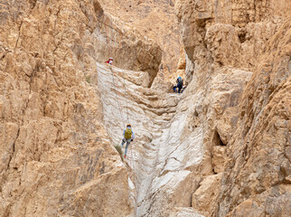 Experienced athletes start the descent with the equipment for snapping in the mountains of the...