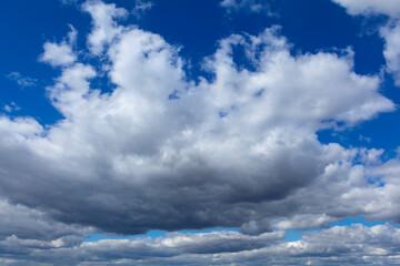 A celestial background of cumulus clouds.