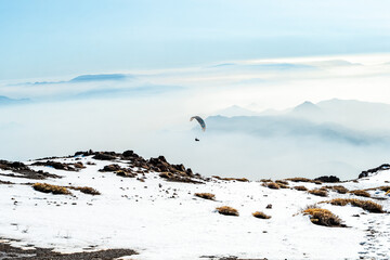 Paragliding on snowy Provincia hill, Chile