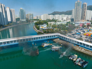 Fototapeta premium Top view of Hong Kong residential district and fire accident on boat