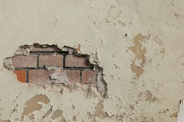 old wall background, Cracked white old cement wall with peeling paint, bricks under the cracked surface, space for text, no person