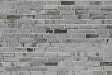 Big brick wall with white and grey stones, very smooth and clean, no person