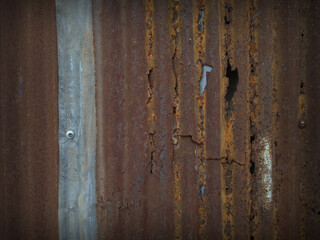 The texture of an old and rusted green steel plate is used as a design background  , old galvanized fence