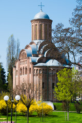 Spring architectural landscape. Church and bushes of forsythia in the center of the Ukrainian city...