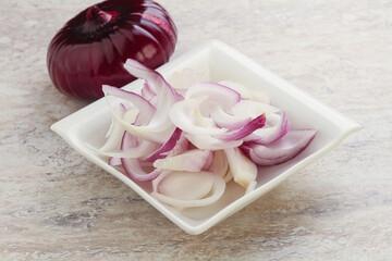 Sliced red onion in the bowl