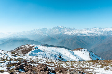 Horizontal view from snow-capped Provincia hill towards the snow-capped Andes mountain range, Chile.