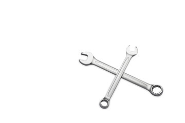 Two wrenches or spanners crossed on white background. Mechanic tools, Repair service concept.