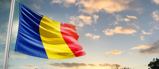 Romania national flag cloth fabric waving on the sky - Image