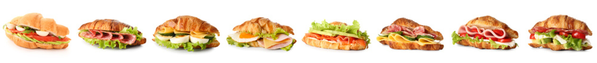 Set of tasty croissant sandwiches on white background