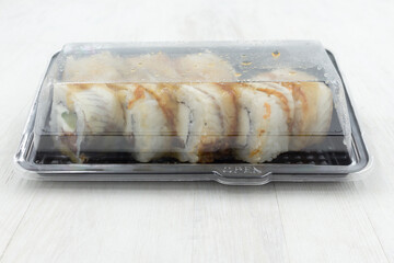 Rolls in a plastic container. Fast food, food delivery.