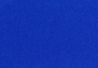 High detail bright dark royal blue paper texture background uncoated rough fiber grain pattern for...