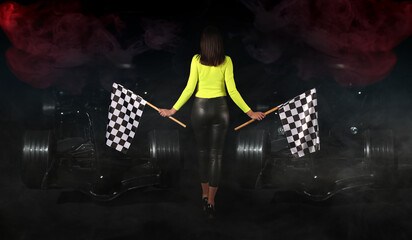 Beautiful young woman with flags and modern racing cars on dark background - obrazy, fototapety, plakaty
