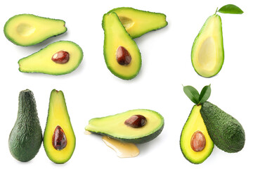 Many halves of fresh avocado isolated on white