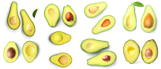 Many halves of fresh avocado isolated on white