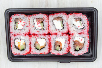 Rolls in a plastic container. Fast food, food delivery.