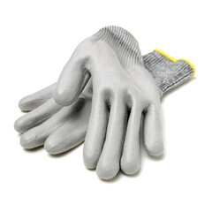 Pair of gray textile work gloves with protective rubber layer isolated on white background with soft shadow 