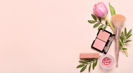 Decorative cosmetics, makeup brush and beautiful flower on pink background with space for text. Mother's Day celebration