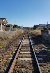 Fototapeta na wymiar Train Track Horizon in a Small Town