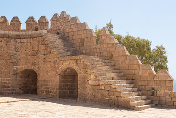 Facade of ancient stone castle and fortress