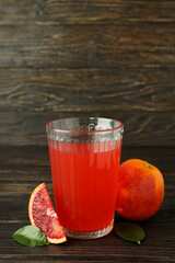 Concept of fresh drink with red orange juice, space for text