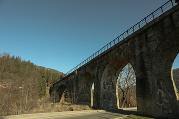 Railroad bridge in Ukrainian Carpathian mountains in sunny day
