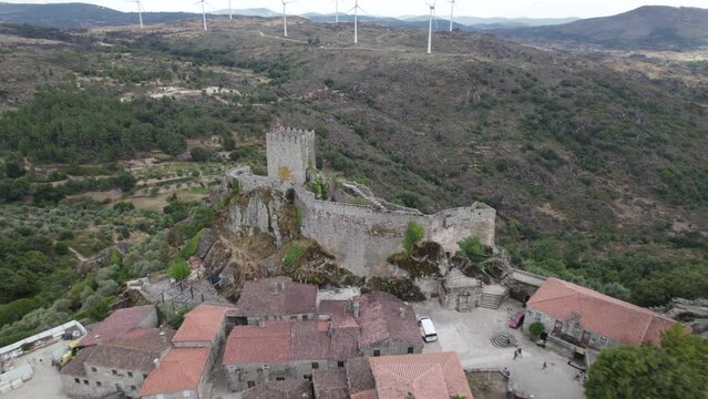 Aerial pullback reveals Castle of Sortelha and its fortifications; Portugal