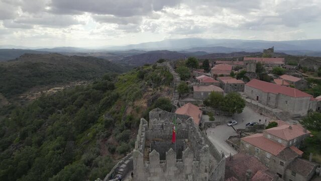 Aerial reveals main keep and historical village of Sortelha Fortress, Portugal